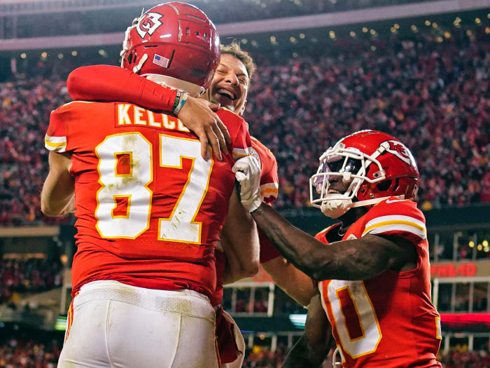 Travis Kelce, Patrick Mahomes and Tyreek Hill celebrate the game-winning touchdown.